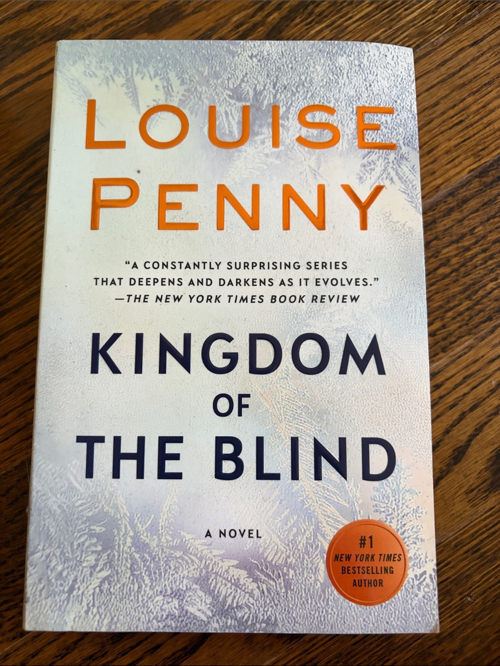Louise Penny "Kingdom of the Blind" Paperback Book - White & Orange Cover